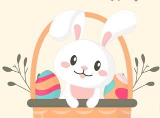 White bunny in a basket with two brightly colored eggs.
